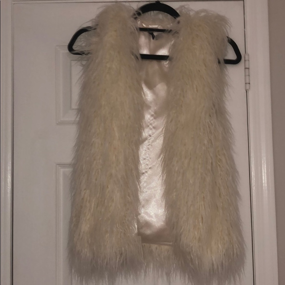 White fur vest